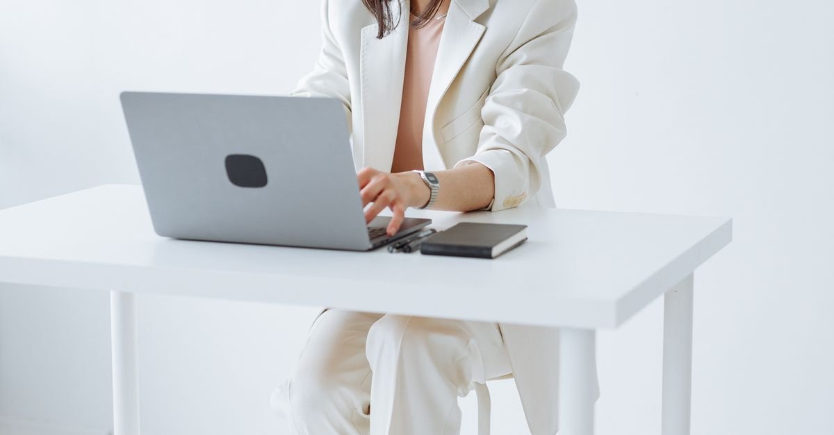 Marketing strategist planning on a laptop