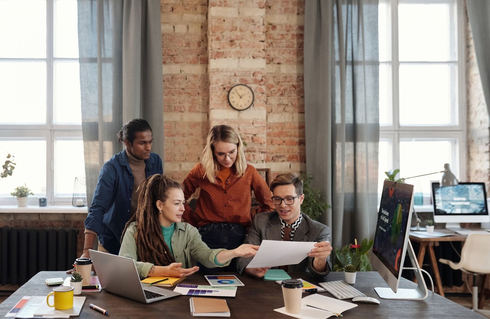 Creative marketing team reviewing campaign work